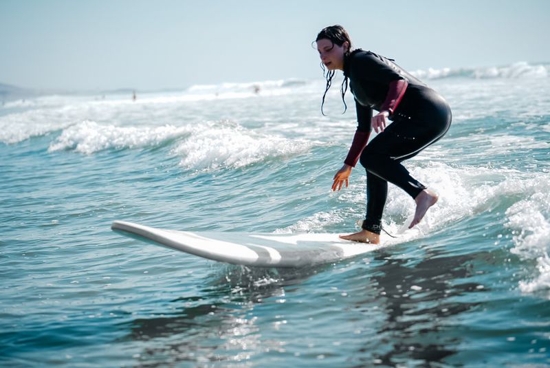 Group surf lesson in the water in Taghazout with a local instructor