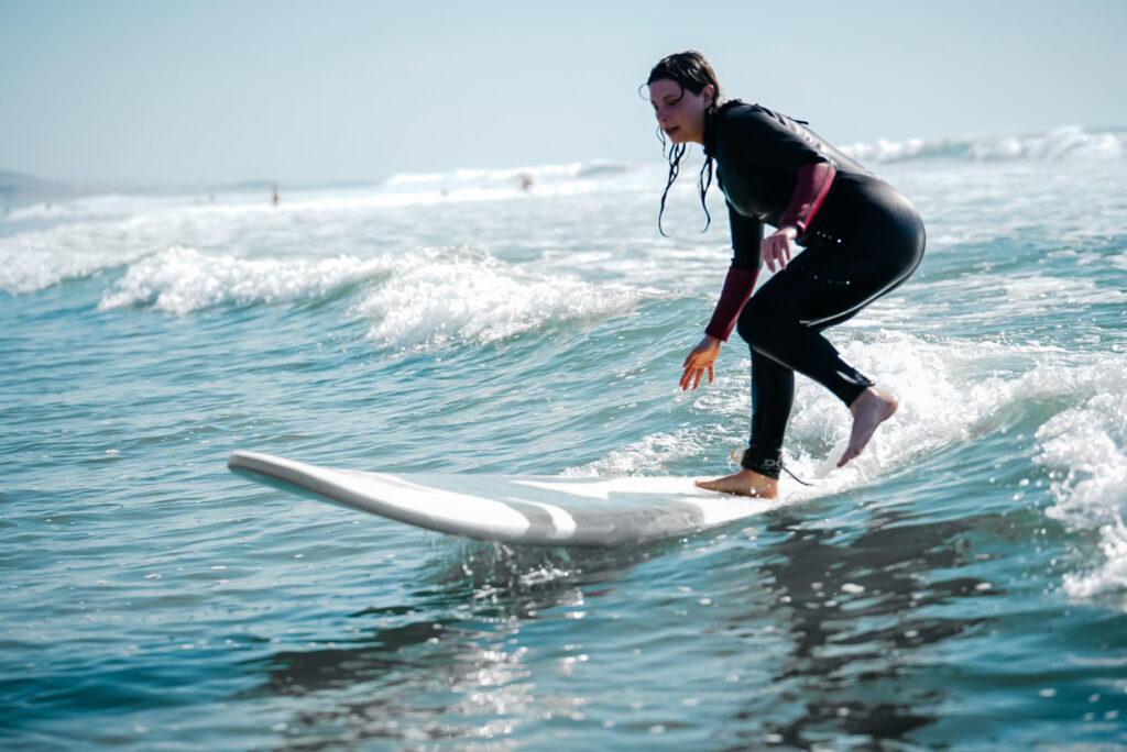 Group surf lesson in the water in Taghazout with a local instructor