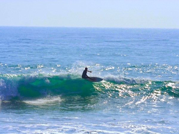 Heavy barrel section at La Source reef break in Taghazout